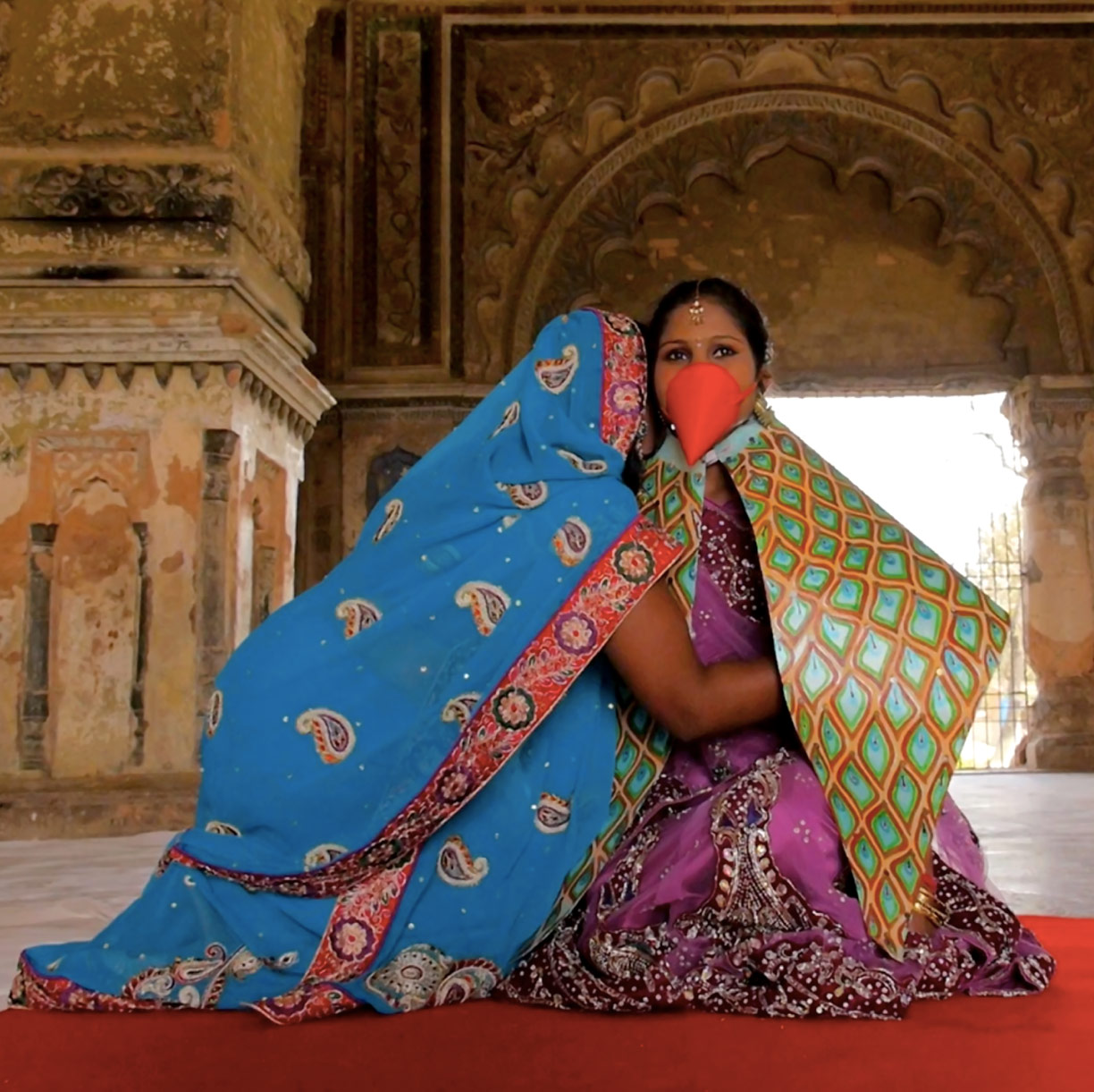 A screen capture from the film "Sama in the Forest" where Sama's mother is holding her and crying about her being turned into a bird.